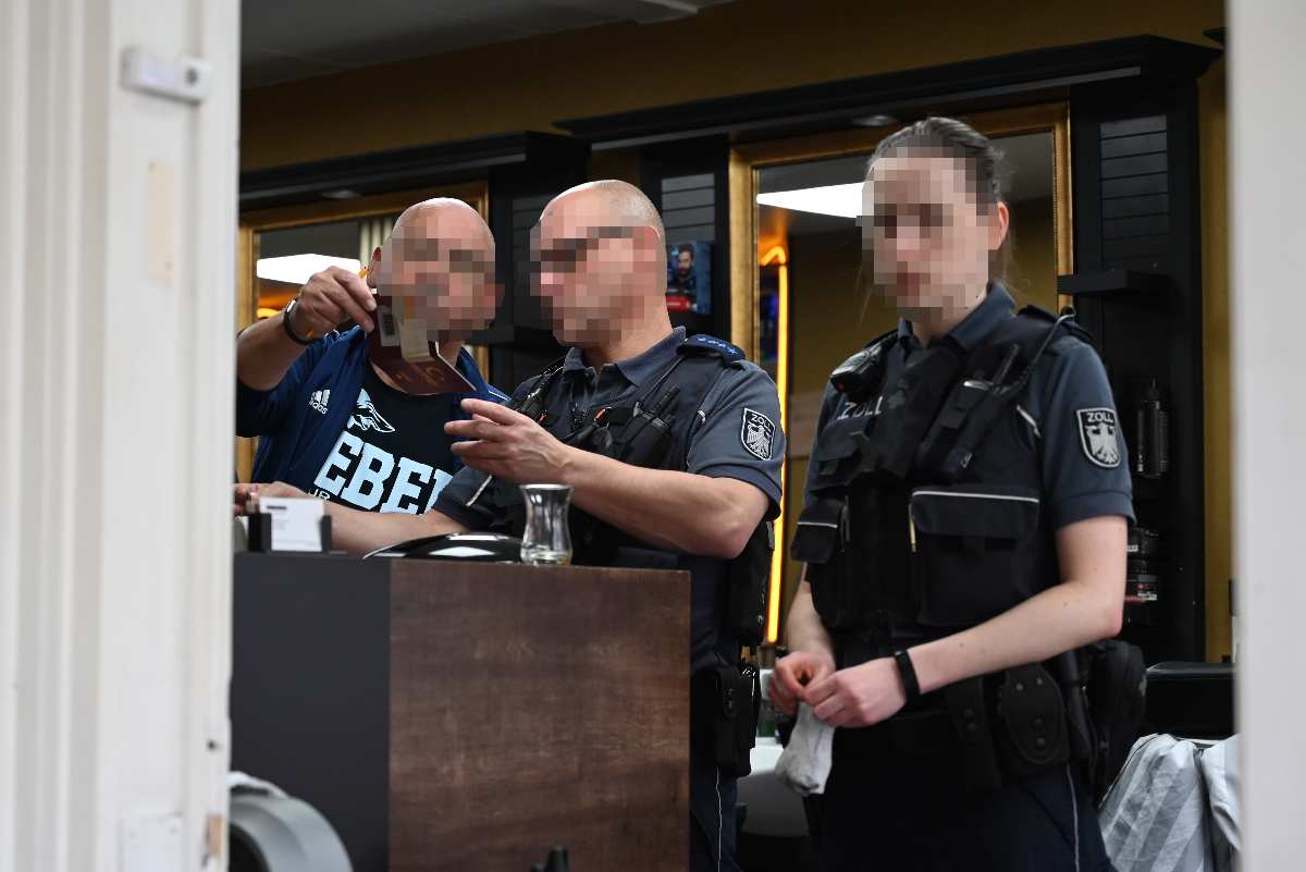 a group of police officers standing behind a counter