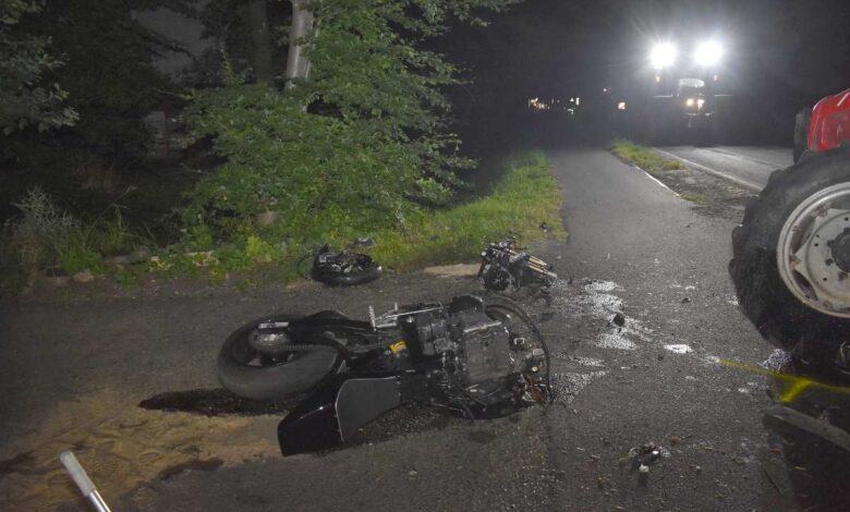 a motorcycle on the road at night
