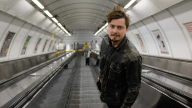 a man standing on an escalator