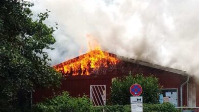 a building on fire with smoke coming out of it