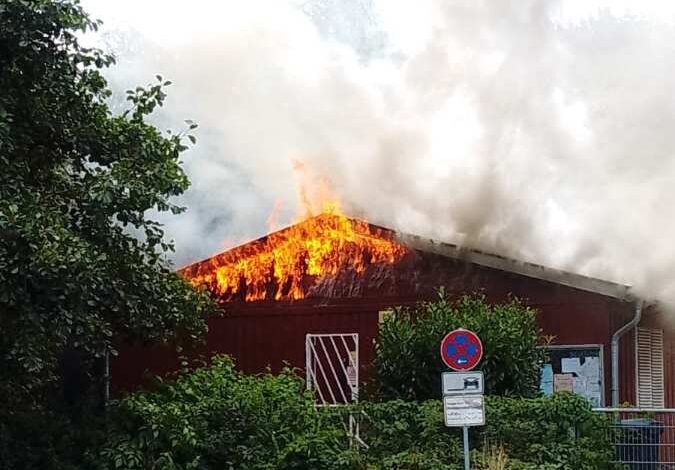 a building on fire with smoke coming out of it