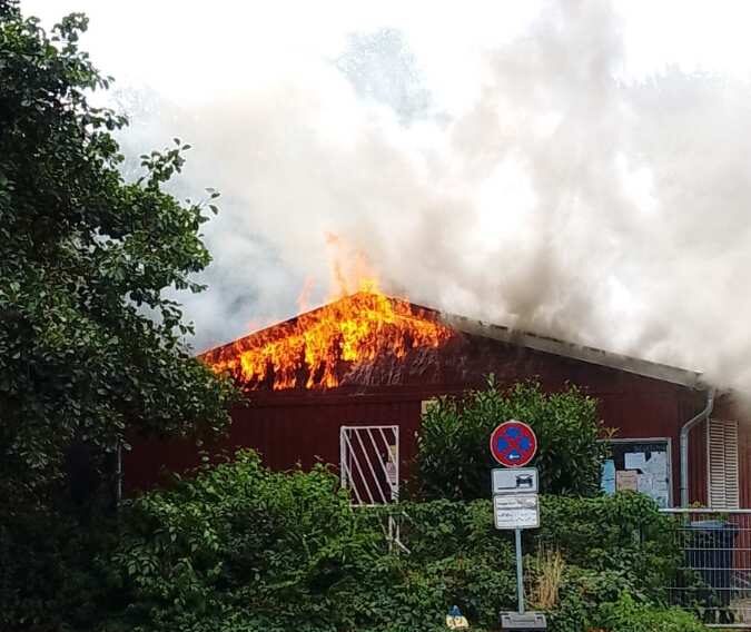 a building on fire with smoke coming out of it