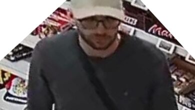 a man wearing a white hat and glasses