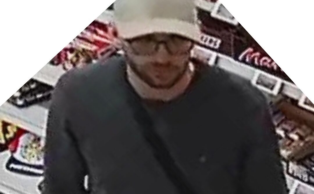 a man wearing a white hat and glasses