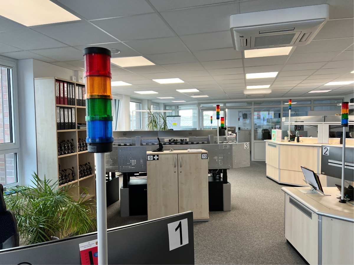 a office with a light pole and shelves