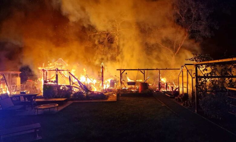 a fire in a backyard at night