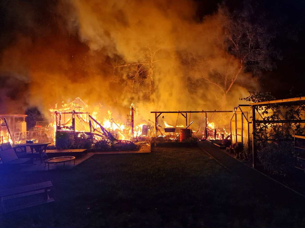 a fire in a backyard at night