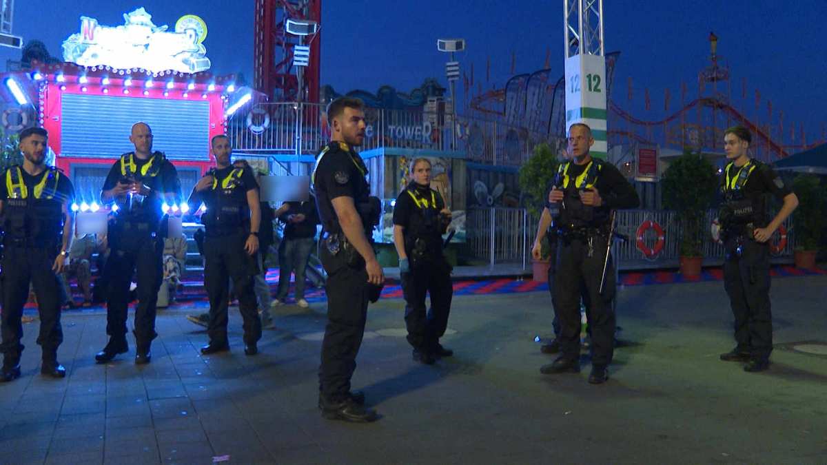 a group of police officers standing in a line
