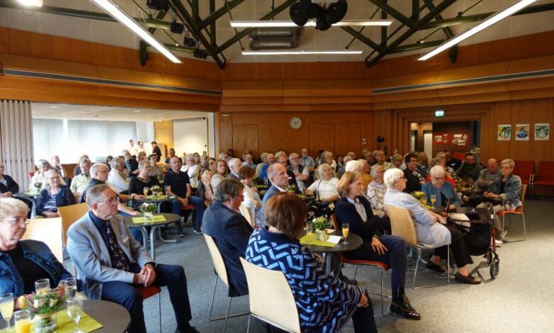 a group of people sitting in a room