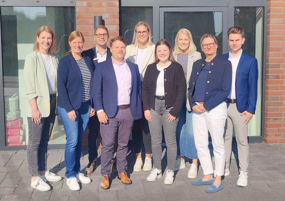 a group of people posing for a photo