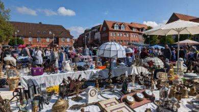 a group of people at a flea market