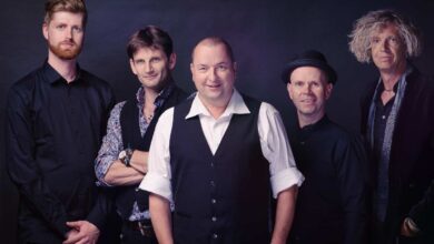 a group of men posing for a photo