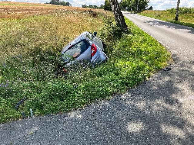 a car crashed into a ditch