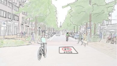 a woman riding a bicycle on a street