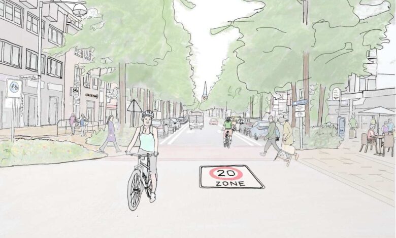 a woman riding a bicycle on a street