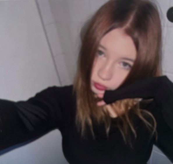 a woman taking a selfie