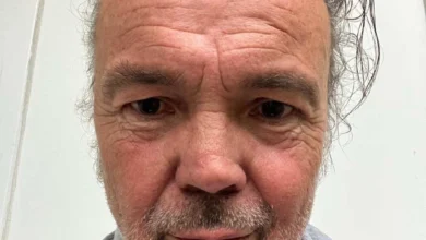 a man with grey hair and beard