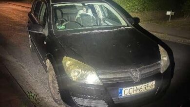 a black car on a road at night