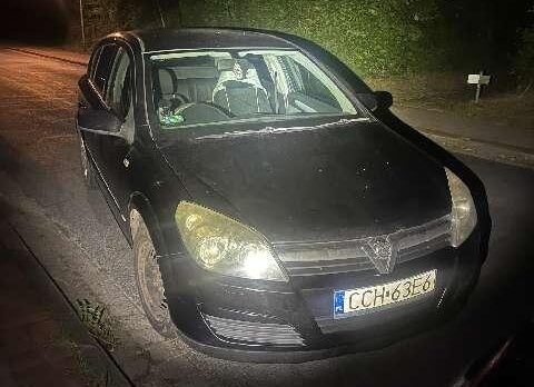 a black car on a road at night
