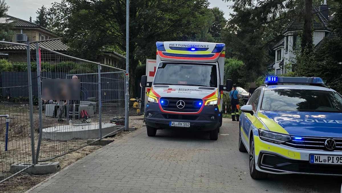 a ambulance and police cars on a street